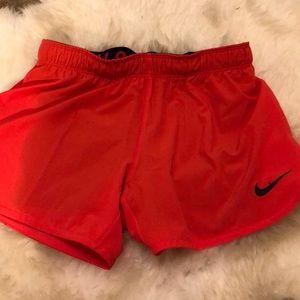 red nike shorts
